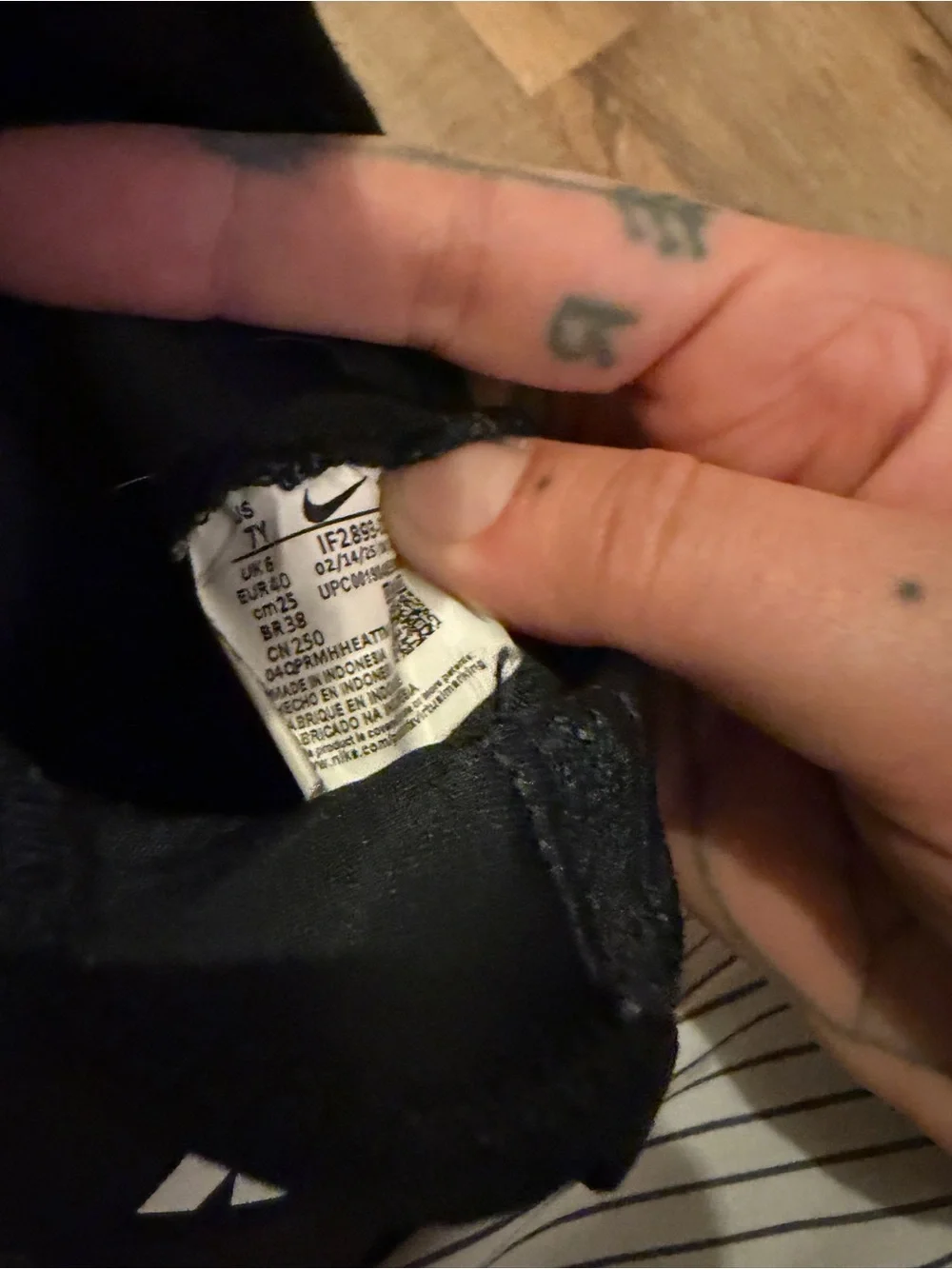 Nike Black Slip-On Sneakers with White Accents